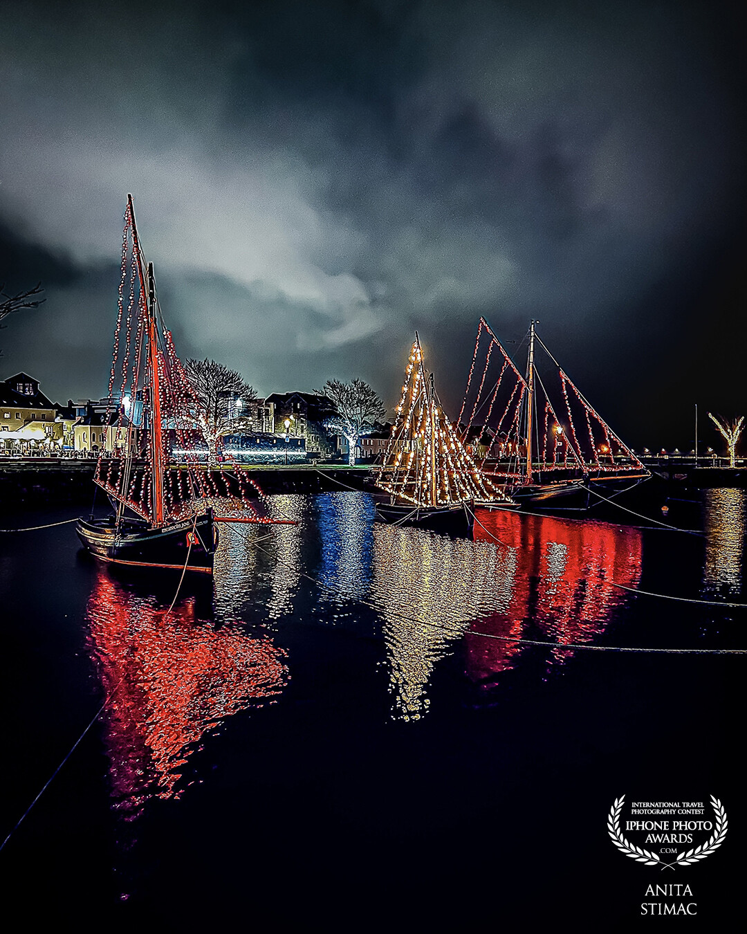 The traditional boat fleet in Galway takes pride in lighting their rigs in the city's basin for special occasions.