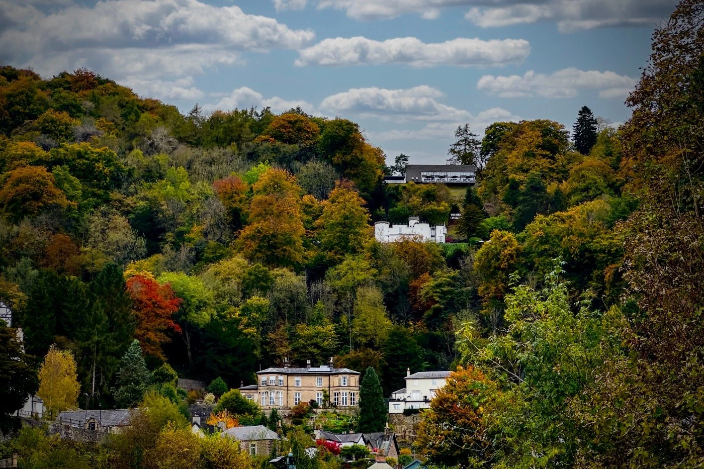 Matlock Bath Derbyshire UK  hillside houses looking down on the town with beautiful autumn colours.