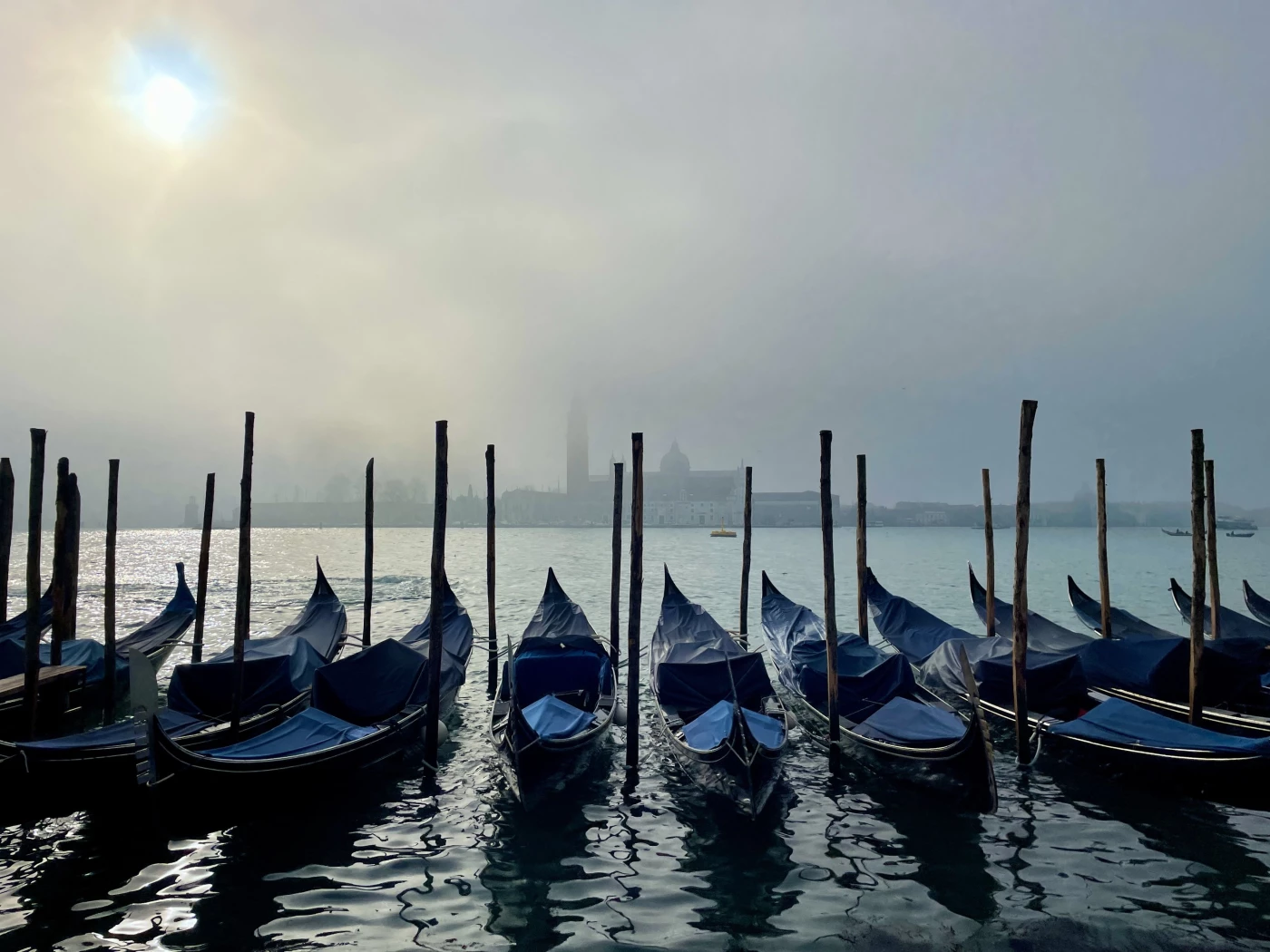 Venice. Magical moment, early in the morning, at the gondola mooring on Riva degli Schiavoni. When t...