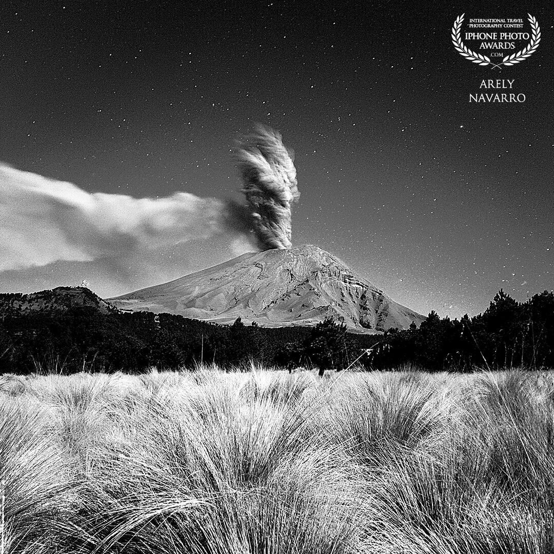 Popocatépetl, an active stratovolcano in central Mexico, emits a towering ash plume, highlighting its ongoing volcanic activity and imposing presence.