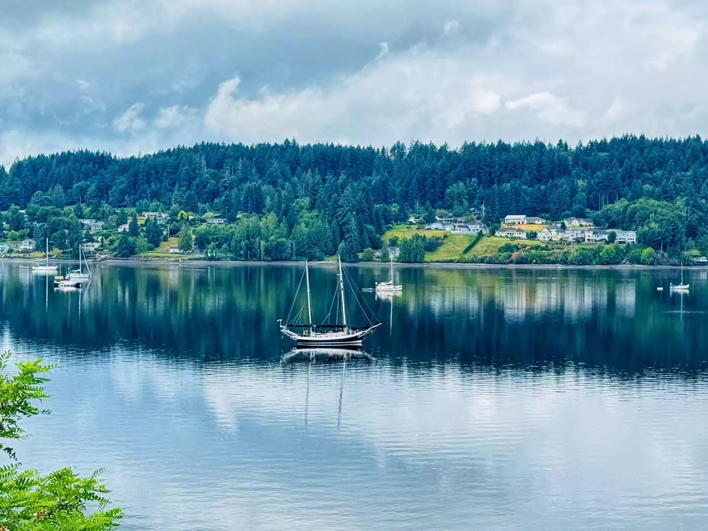 This sailboat sitting in the shadow of the bay with the sky reflected beside it caught my eye like a...